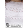 Mountain Frill by DROPS Design - Patron de tricot pour chemisier taille S - XXXL